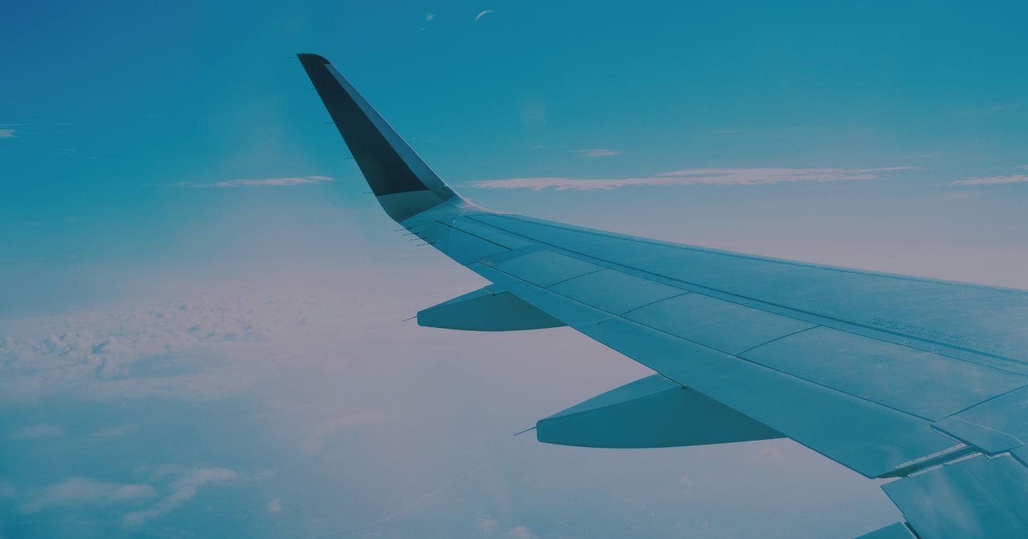 The wing of a passenger plane as viewed from inside the plane